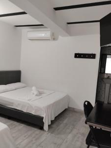 Postel nebo postele na pokoji v ubytování Hotel Ozzy
