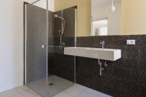 a bathroom with a sink and a shower at Visitsicilia Vasile 9 in Castellammare del Golfo +41 photos