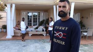 a man standing in front of a house with people at Bayside Concha House - Beachfront Oasis with Heated Pool in Playa Honda
