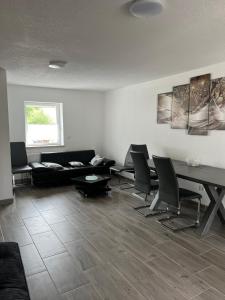 Posezení v ubytování Ferienhaus Zum Heilbrunnen