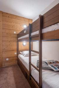 Ein Bett oder Betten in einem Zimmer der Unterkunft Résidence Pierre & Vacances Le Quartz