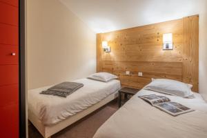 Ein Bett oder Betten in einem Zimmer der Unterkunft Résidence Pierre & Vacances Le Quartz