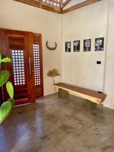 a room with a wooden bench on the wall at HAMA Villa with private pool in El Nido +23 photos