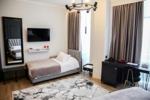 Postel nebo postele na pokoji v ubytování Sky Hotel Korce