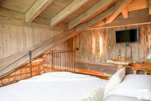 Postel nebo postele na pokoji v ubytování CHALET ANTICO LEGNO by Design Studio