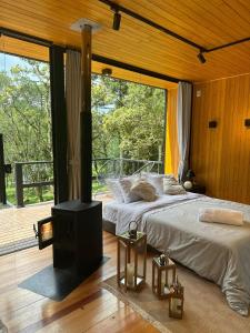 Una cama o camas en una habitación de Taipa Cabanas