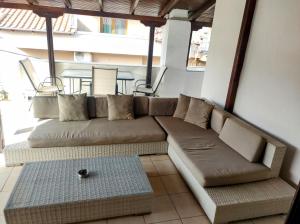 a living room with a couch and a table at Lion Apartment in Limenas