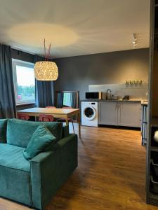 Area soggiorno di Little green studio in Maardu