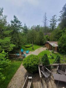 an aerial view of a backyard with benches and a cabin at ReTreat yourself in Port Franks in Lambton Shores