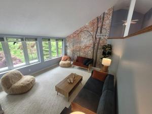 a living room with a couch and a table at ReTreat yourself in Port Franks in Lambton Shores