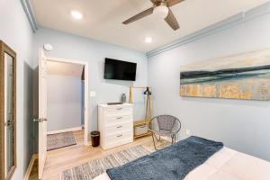 a bedroom with a bed and a tv on the wall at Waterfront Lake Hamilton Vacation Rental with Dock! in Royal