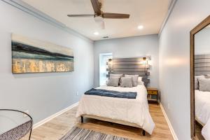 a bedroom with a bed and a ceiling fan at Waterfront Lake Hamilton Vacation Rental with Dock! in Royal