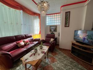 Televízia a/alebo spoločenská miestnosť v ubytovaní Joker Villa Apartmanhaus