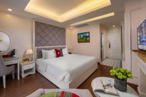 Postel nebo postele na pokoji v ubytování Sapa Praha Hotel