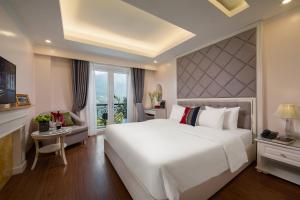 Postel nebo postele na pokoji v ubytování Sapa Praha Hotel