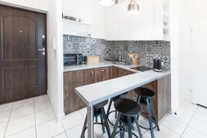 Kuchyň nebo kuchyňský kout v ubytování Wyjątkowy Apartament na Rynku + 9 fotografií