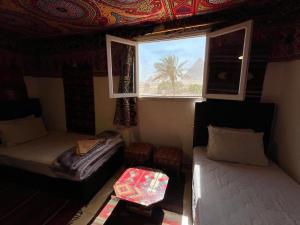 Vuode tai vuoteita majoituspaikassa Kemet Pyramids Room view