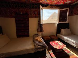 Vuode tai vuoteita majoituspaikassa Kemet Pyramids Room view