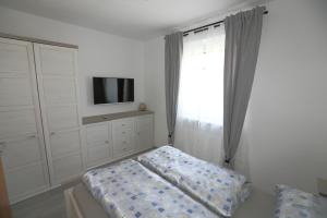 Postel nebo postele na pokoji v ubytování Ferienwohnung Sölkner