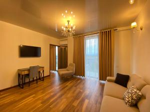 TV a/nebo společenská místnost v ubytování Hotel Leonardo