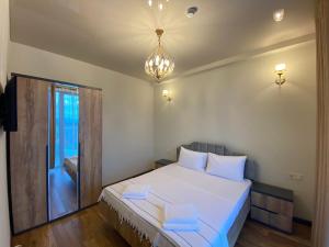 Postel nebo postele na pokoji v ubytování Hotel Leonardo