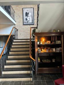 a staircase in a home with a stair case at Atalanta-Wellness Roermond 'de Archivaris' in Herten