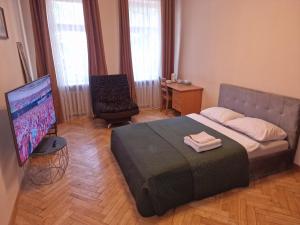 Postel nebo postele na pokoji v ubytování Kaunas Center Apartment