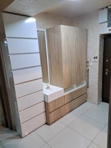a small bathroom with a sink and a mirror at Nena Apartment in Kumanovo