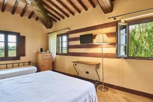 A bed or beds in a room at Borgo San Giusto