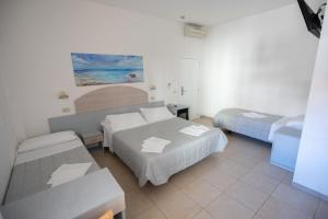Ένα ή περισσότερα κρεβάτια σε δωμάτιο στο Hotel Petite Fleur
