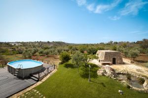 an aerial view of a house with a swimming pool at Aura Solis B&B in Leuca