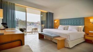 Ένα ή περισσότερα κρεβάτια σε δωμάτιο στο Barceló Praia Cape Verde
