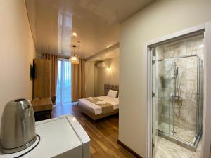 Postel nebo postele na pokoji v ubytování Hotel Leonardo