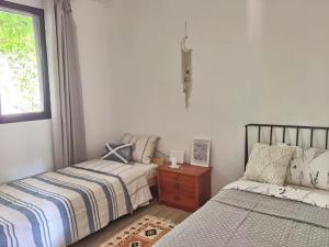 Letto o letti in una camera di Villa Seashell