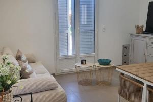 a living room with a couch and a table at Casa Figarella in Calenzana