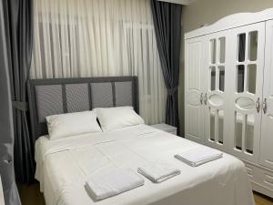 Postel nebo postele na pokoji v ubytování Köseoğlu APART