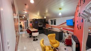 an office with a desk and chairs in a room at Le Loudy in Échillais +7 photos