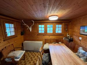 a wooden room with a wooden table in a cabin at Chalet in Niederwald in Niederwald