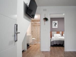 Posteľ alebo postele v izbe v ubytovaní Apartamentos Loncho Finisterre