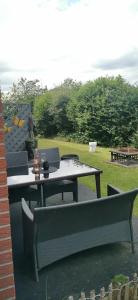 a picnic table with two chairs at Apartment mit Garten in Bad Lauterberg