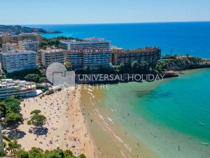 an aerial view of a beach in a resort at UHC Bahia Family Complex in Salou