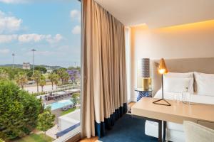 a hotel room with a view of a resort at Palácio do Governador - Lisbon Hotel & Spa in Lisbon
