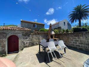 a table and chairs sitting on a patio at Casa Pavão in Pilar