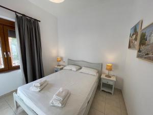 Postel nebo postele na pokoji v ubytování Petra Casa