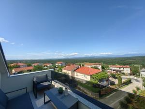 a view from the balcony of a house at Green View Apartment in Vrh