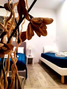 Postel nebo postele na pokoji v ubytování Al Teatro Suites