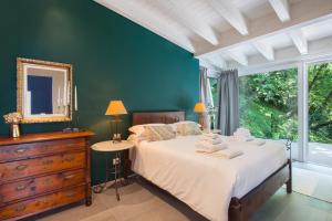 a bedroom with a bed with a mirror and a dresser at Only Adult Villa Montelago With Pool in Pai +22 photos