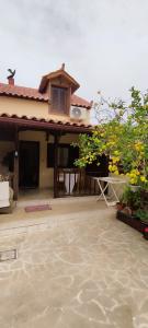a house with a balcony and a house with at Gialova Filoxenia in Gialova