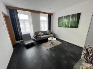 a living room with a couch and a table at Sivas Ferienwohnung 2 in Ravensburg