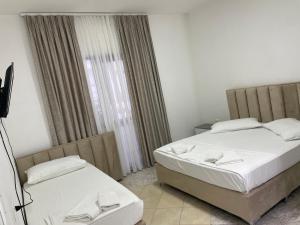 Postel nebo postele na pokoji v ubytování Hotel Ani